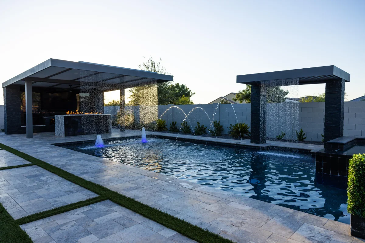Completed luxury Arizona custom pool with integrated water features and modern landscaping